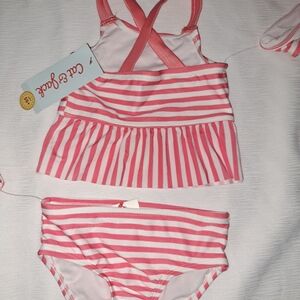 swimsuits for girls, size 12 and 18 months, from the cat and Jack brand.